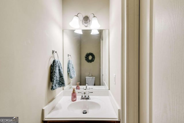 bathroom with vanity and toilet