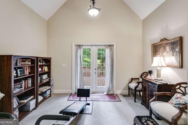 exercise room featuring carpet flooring, french doors, and high vaulted ceiling