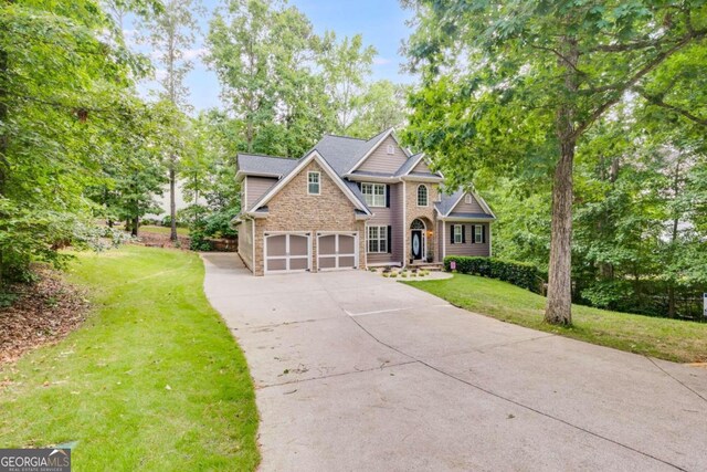 view of front facade with a front lawn and a garage