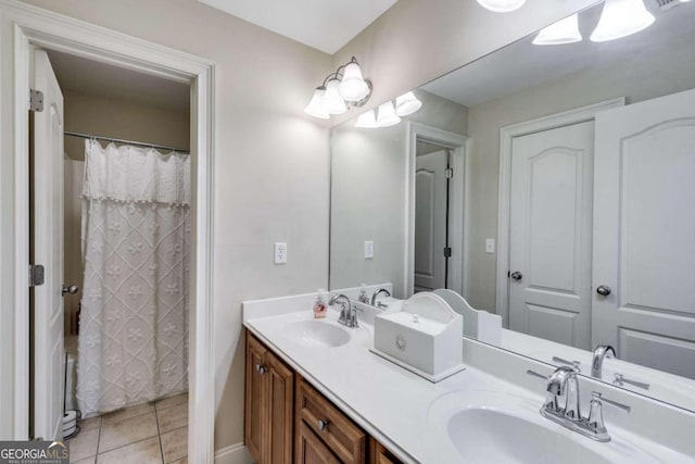 bathroom featuring tile patterned flooring and vanity