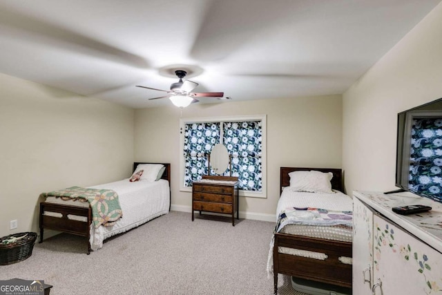 bedroom with ceiling fan and light colored carpet