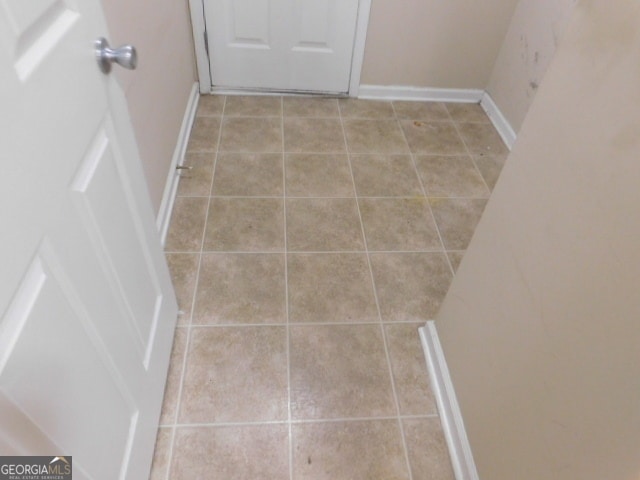 interior space with light tile patterned floors