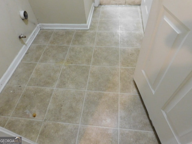 laundry area featuring tile patterned floors