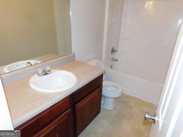 full bathroom featuring vanity, toilet, and washtub / shower combination