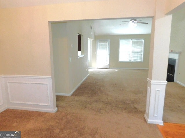 corridor with light colored carpet