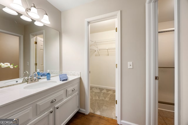 bathroom with vanity and wood-type flooring