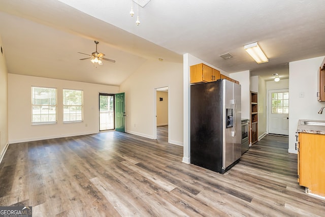 kitchen with ceiling fan, plenty of natural light, dark hardwood / wood-style floors, and appliances with stainless steel finishes