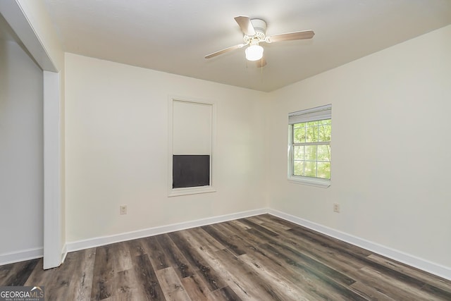 unfurnished room featuring dark hardwood / wood-style floors and ceiling fan