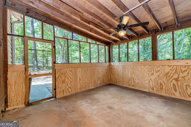 unfurnished sunroom with vaulted ceiling and ceiling fan