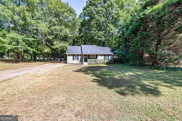 ranch-style home with a porch and a front lawn