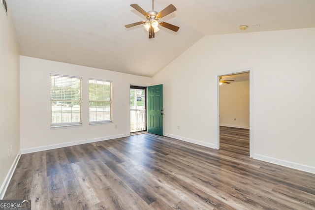 spare room with ceiling fan, dark wood-type flooring, and lofted ceiling