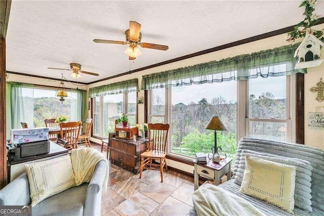 sunroom / solarium with ceiling fan