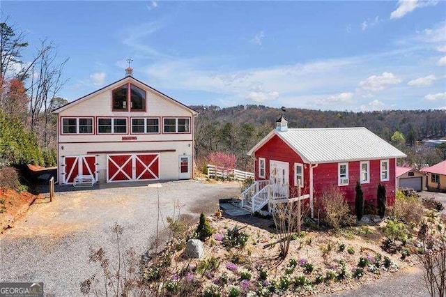 view of front facade with an outbuilding