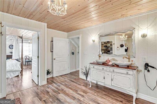 bathroom with wood ceiling, vanity, and wood-type flooring