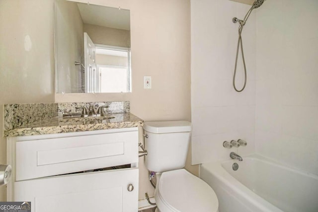 full bathroom featuring vanity, toilet, and tiled shower / bath