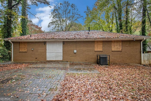 back of house featuring a patio area and central air condition unit