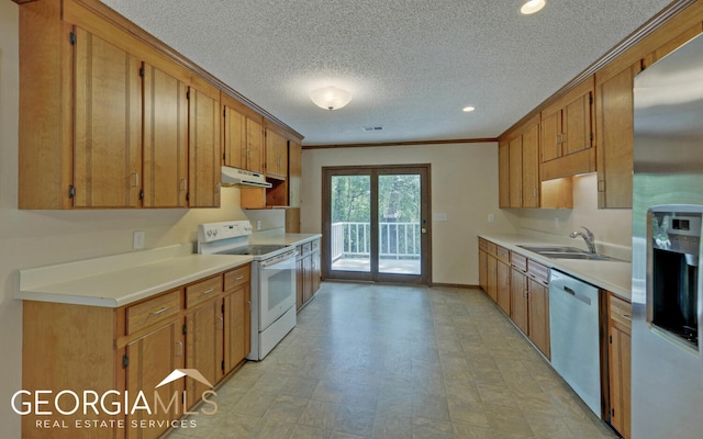 kitchen with sink, ornamental molding, a textured ceiling, and appliances with stainless steel finishes