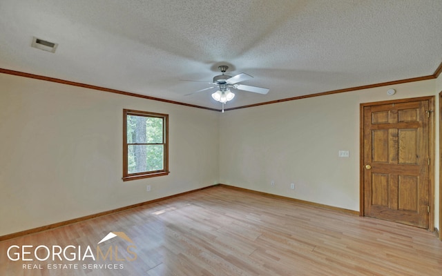 empty room with ceiling fan, light hardwood / wood-style floors, crown molding, and a textured ceiling