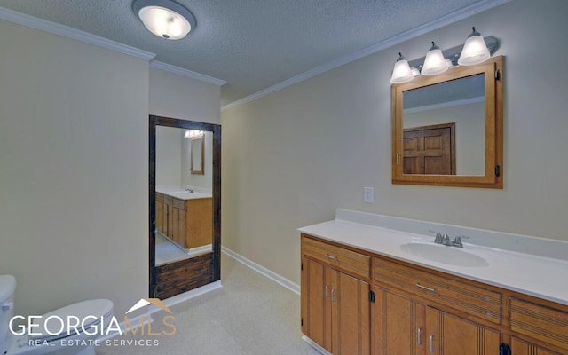 bathroom with toilet, vanity, a textured ceiling, and ornamental molding