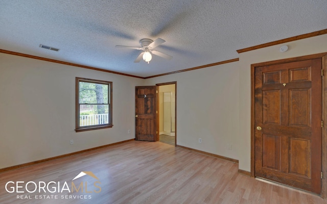 unfurnished bedroom with a textured ceiling, light hardwood / wood-style flooring, ceiling fan, and ornamental molding