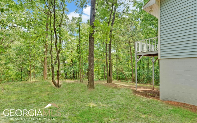 view of yard featuring a wooden deck