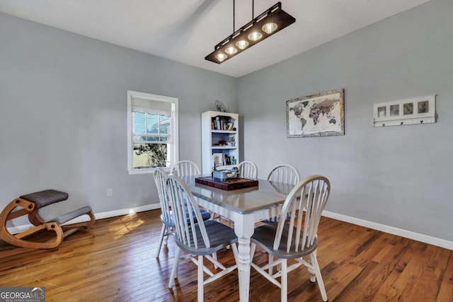 dining area with hardwood / wood-style floors