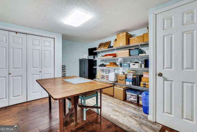 interior space with hardwood / wood-style floors and a textured ceiling