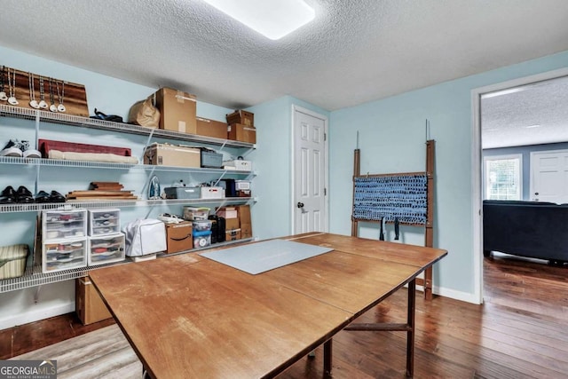 office area featuring hardwood / wood-style flooring and a textured ceiling