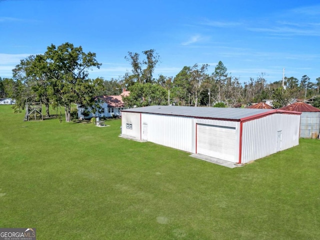 view of outdoor structure featuring a yard