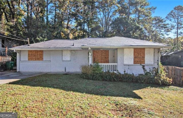 single story home with a front lawn and a porch