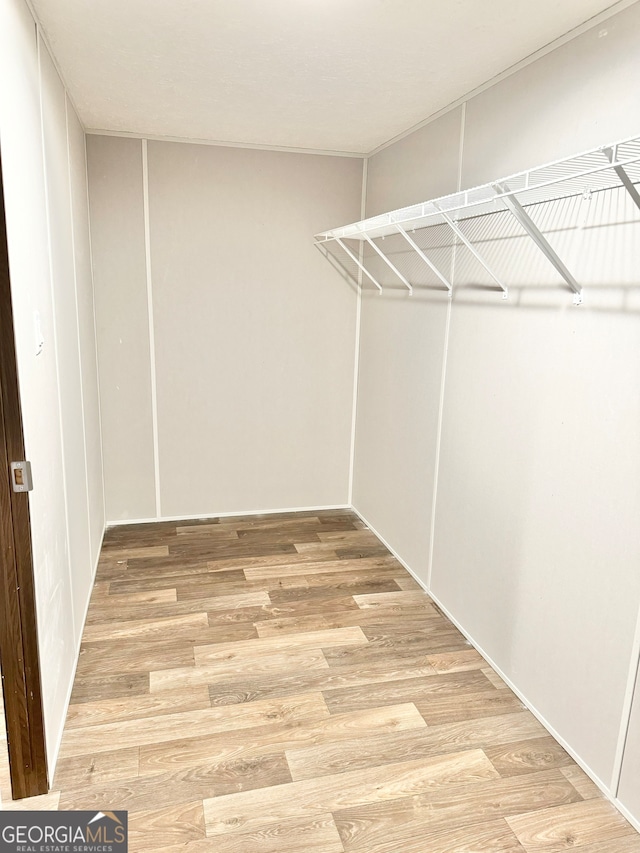 walk in closet featuring light wood-type flooring