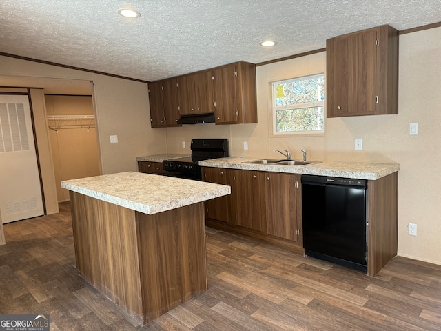 kitchen featuring sink, dark wood-type flooring, extractor fan, a textured ceiling, and black appliances