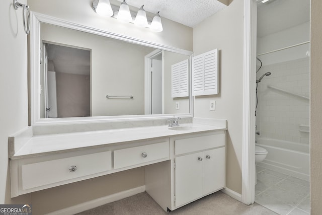 full bathroom featuring toilet, a textured ceiling, tiled shower / bath, and vanity