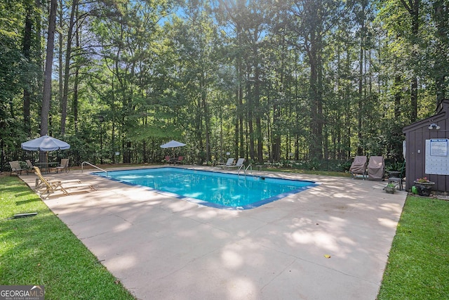 view of pool featuring a patio area