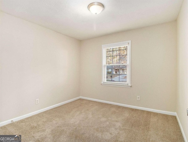 3811 Paul St, Douglasville, GA 30135 - carpeted empty room featuring baseboards