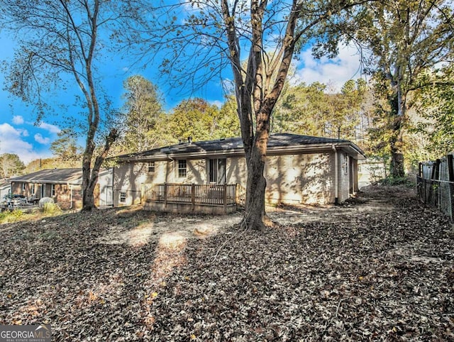 3811 Paul St, Douglasville, GA 30135 - rear view of house with a wooden deck and brick siding