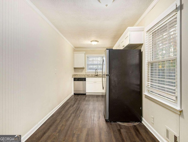 kitchen with sink, ornamental molding, dark hardwood / wood-style flooring, white cabinetry, and stainless steel appliances