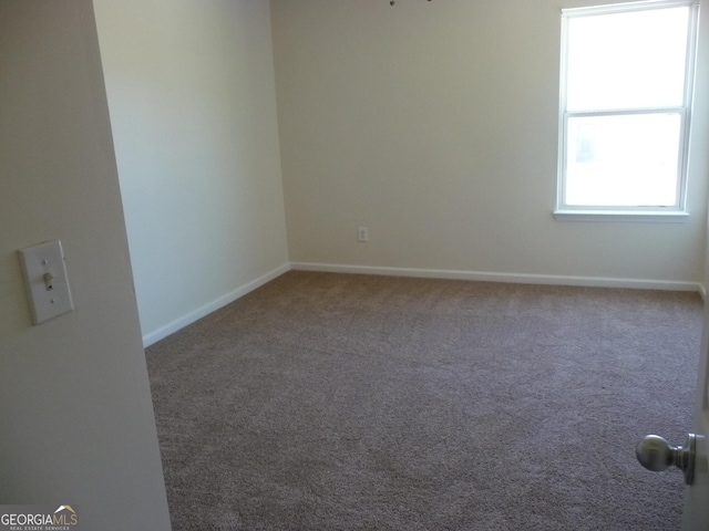 empty room featuring carpet flooring