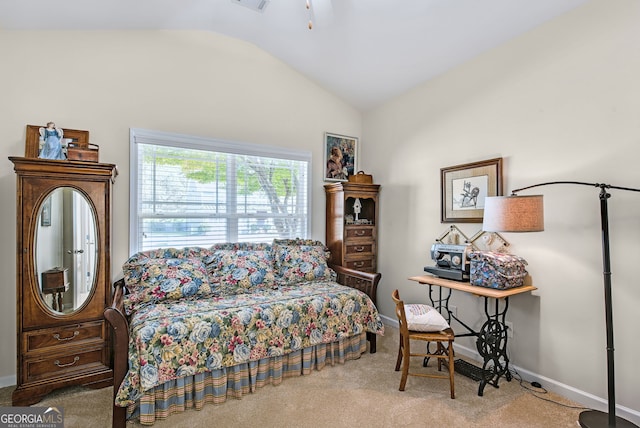 carpeted bedroom featuring lofted ceiling