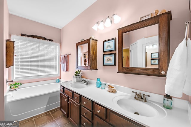 bathroom featuring vanity, tile patterned floors, and a bathtub