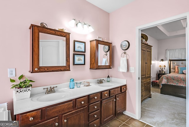 bathroom with tile patterned floors and vanity