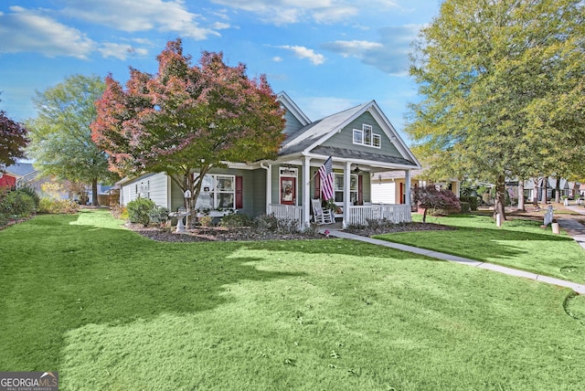 view of front of property with a front yard and a porch