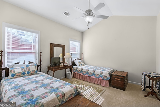 bedroom featuring multiple windows, ceiling fan, light carpet, and lofted ceiling