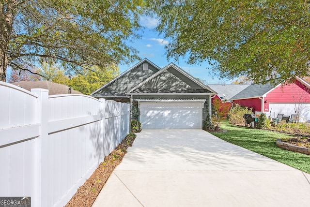 view of front facade with a garage and a front yard