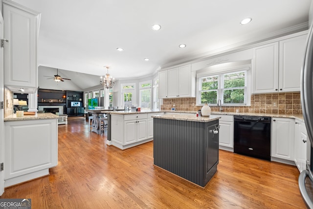 kitchen featuring ceiling fan with notable chandelier, white cabinetry, light hardwood / wood-style flooring, dishwasher, and a kitchen island