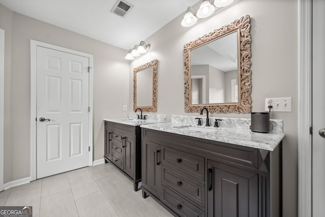 bathroom with vanity and tile patterned floors