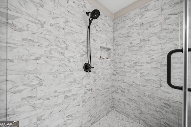 room details featuring tiled shower