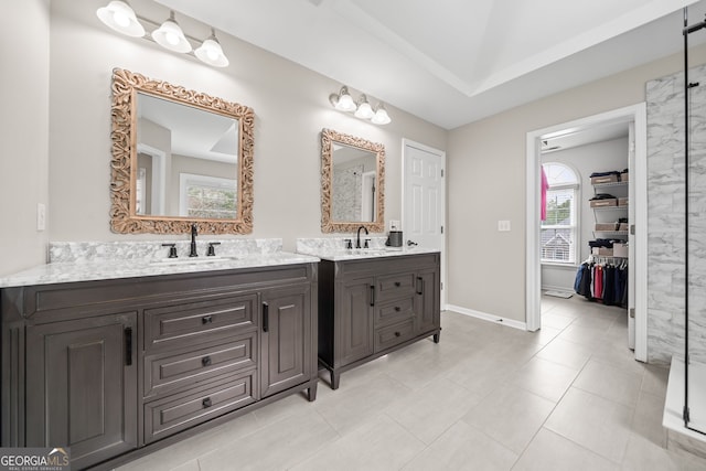 bathroom with tile patterned flooring and vanity