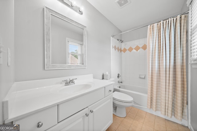 full bathroom featuring tile patterned flooring, shower / bath combination with curtain, vanity, and toilet