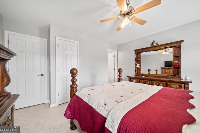 bedroom with light colored carpet and ceiling fan